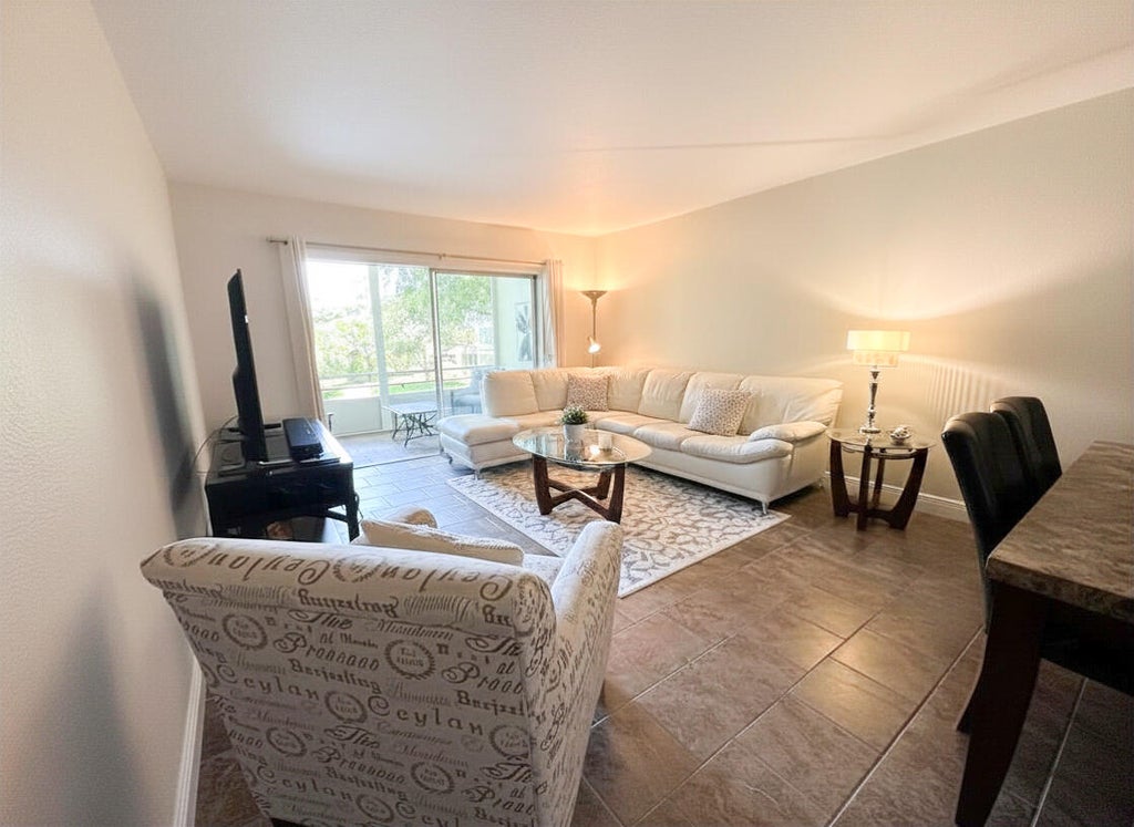 Photo of 5131 W Oakland Park Boulevard #202, Lauderdale Lakes, FL 33313 (MLS # B26047252)