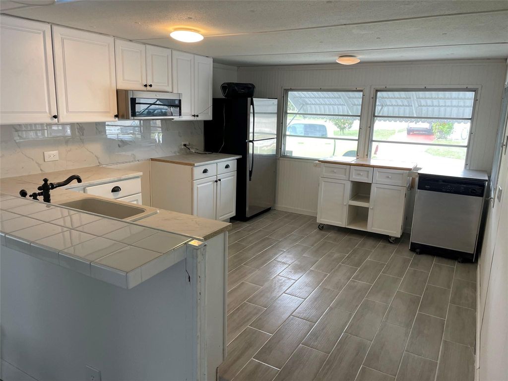 Photo of 8570 SW 21st Street, Davie, FL 33324 (MLS # B26028375)