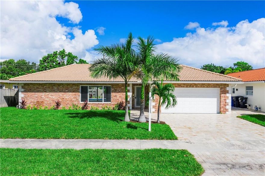 Welcome home to a COMPLETELY RENOVATED residence located in the highly desirable neighborhood of Imperial Point! This 3 bedrooms/2 baths/2-car garage POOL home features an open floor plan concept with impact windows/doors, porcelain floors and recessed lighting throughout. The new kitchen is equipped with new stainless steel appliances, white shaker cabinets and quartz counter tops. The 2 bathrooms were completely remodeled with white shaker cabinets and frameless shower doors. The fenced outdoor space offers a resurfaced pool, travertine throughout and a beautiful large covered area . The A/C is less than 2 years old, new water heater, new washer and dryer (stackable) and new flat roof.  This house is ready for its new owners and their final touches to make it home!