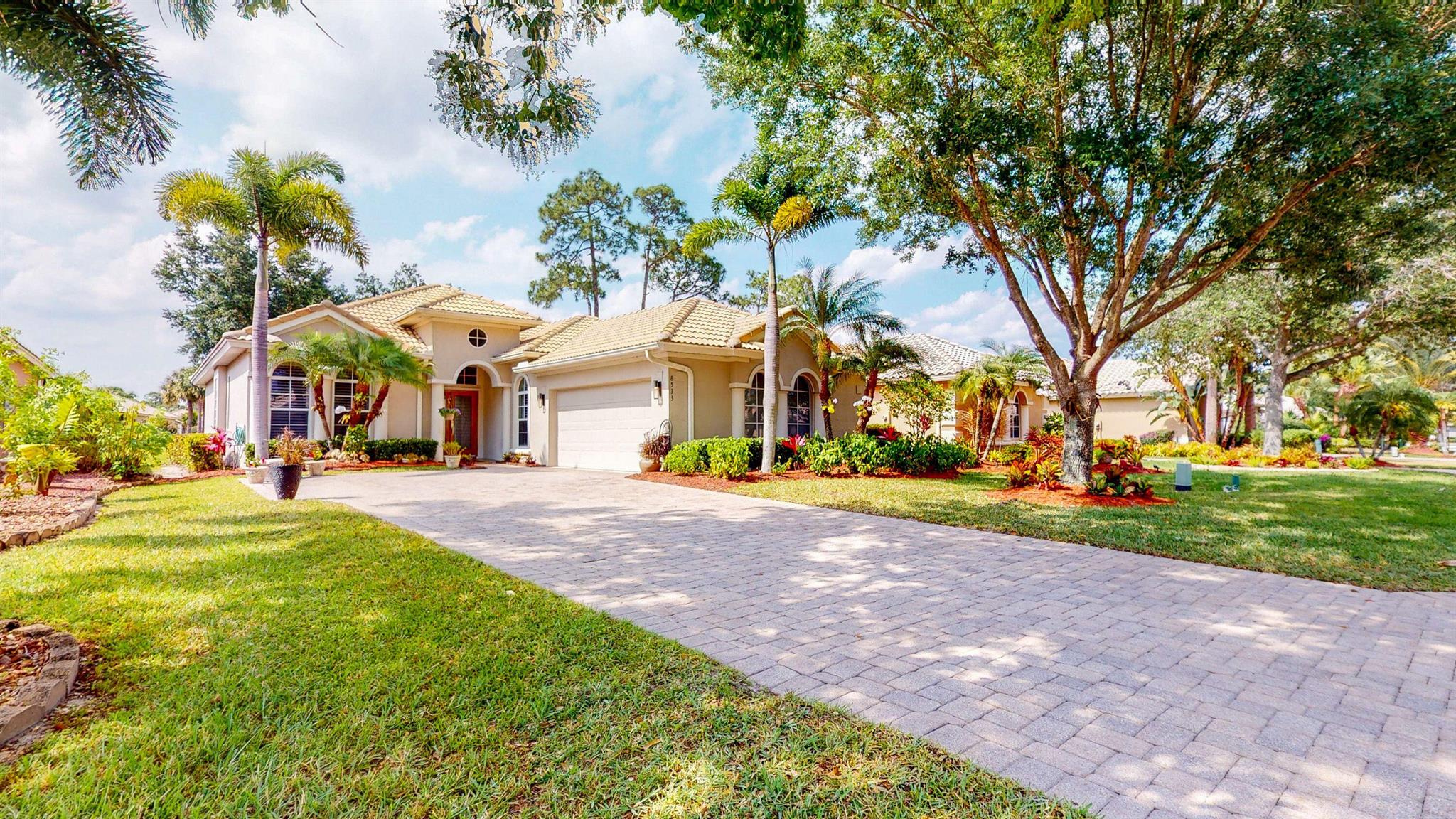 Amazing Spacious home with beautiful lake view. This home feels brand new! With 2 bedrooms plus den/office. Open floor plan. Home comes with multiple architectural details such as tray ceilings, walls with rounded corners, niches, & pocket doors. Offers tile in all areas. Updated kitchen with granite counters. Custom soft close cabinets, Stainless Steel appliances, opening to breakfast area & great room. Master suite with sitting area, spa like bath with frame-less walk-in shower, separate soaking tub, double sinks, that leads to office/den. Enjoy covered screened, private tiled lanai while you view the beautiful lake. Exterior is being painted. Found in the heart of PGA Village & located near to the PGA Club House, this home captures the essence of this luxury community. ***MUST SEE**
