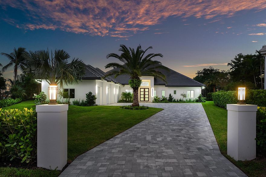 Absolutely MINT! Offering an impressive .65 acre Lot with both serene golf course & lake views, this sprawling estate is on the very end of the prime cul de sac of Glenbrook Ct. One of Atlantis' trophy properties is now available - with a complete remodel ready for its new and proud owner. One level, soaring ceilings and tall windows immediately greet you as you walk through your modern double door entry. Experience luxury living with 48x48 porcelain tile floors spread across over 4300 SF of living space, two living areas, an 18ft formal dining room, all adjacent to your modern kitchen with an oversized island, Italian cabinetry, 6-burner gas range and top end appliances. Picturesque views from nearly every room and plenty of sun shining through with an Eastern backyard exposure.