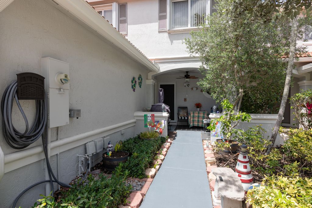 Photo of 7138 Hawks Nest Terrace, Riviera Beach, FL 33407 (MLS # R10977457)