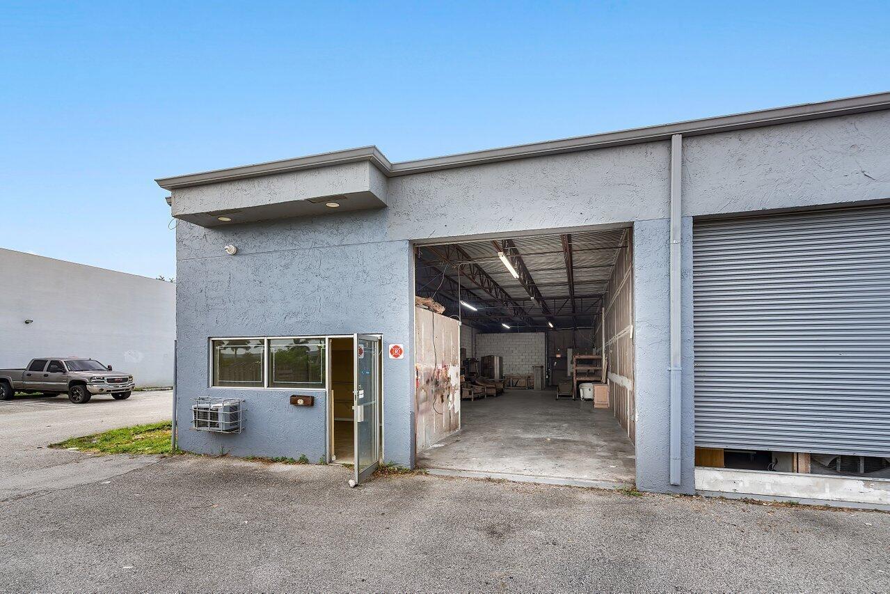 office/warehouse view from Atlantic Blvd. 1 office 1 bathroom and 1 roll-up door.12'H No Automovtive or Bakery allowed per zoning.
