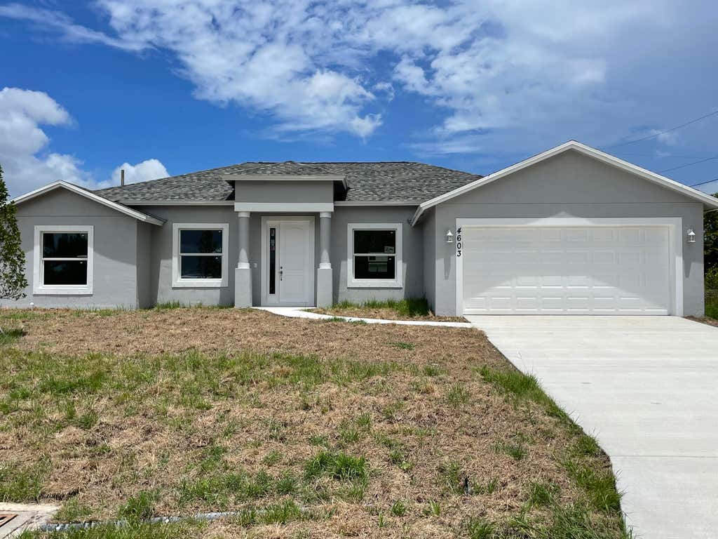 Photo of 913 SW Janette Sw Avenue Ave, Port St Lucie, FL 34953 (MLS # R10806839)