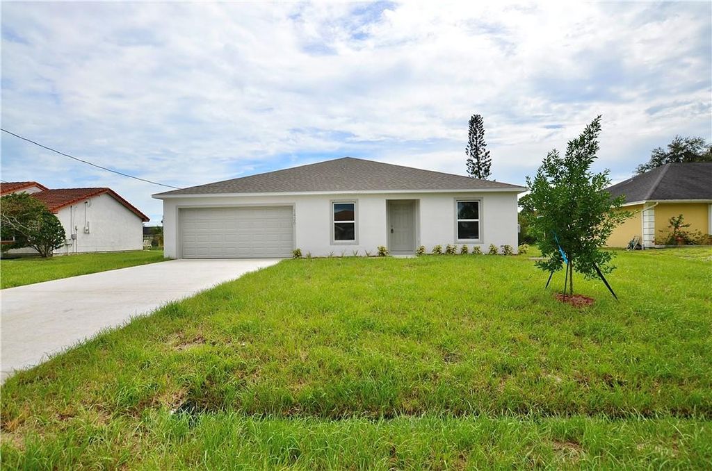 Photo of 1426 SW Merchant Lane, Port Saint Lucie, FL 34953 (MLS # F10518521)