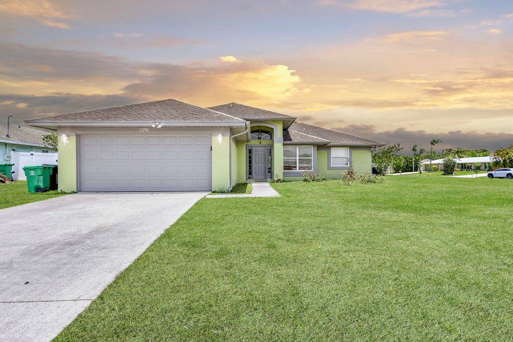 Photo of 1591 SE Airoso Boulevard, Port Saint Lucie, FL 34953 (MLS # R10999399)