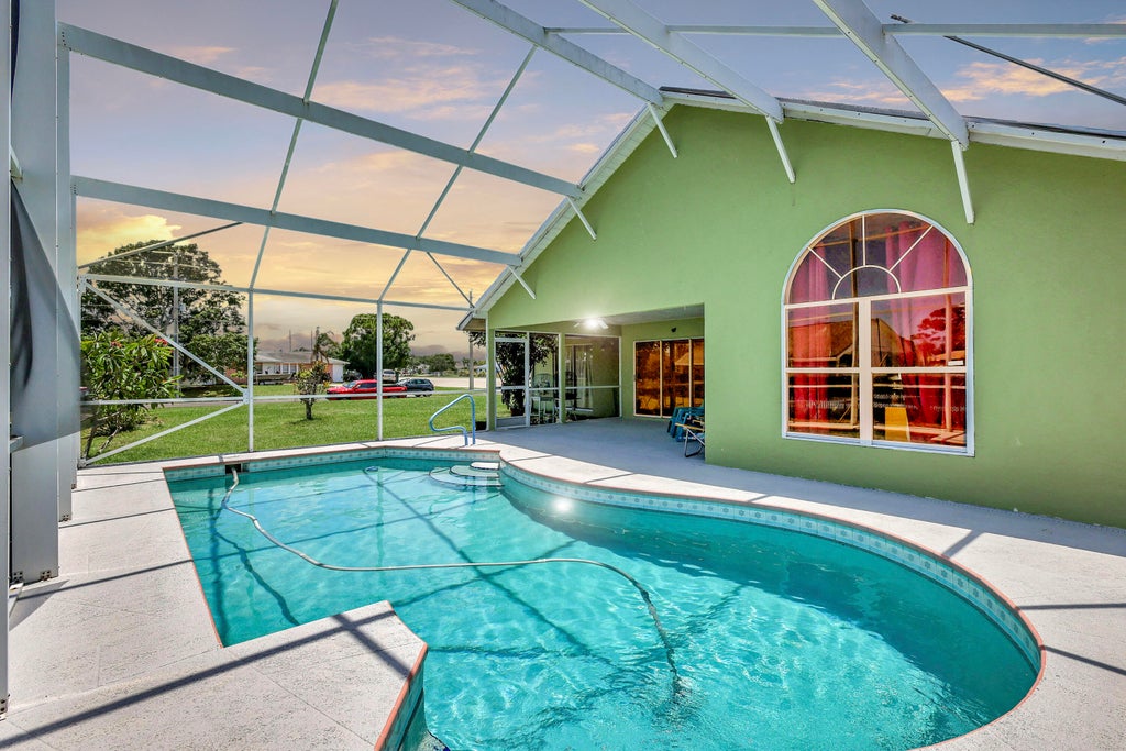 Photo of 1591 SE Airoso Boulevard, Port Saint Lucie, FL 34953 (MLS # R10999399)