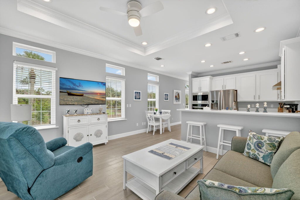 Photo of 301 NE Coastal Drive, Jensen Beach, FL 34957 (MLS # R11124042)