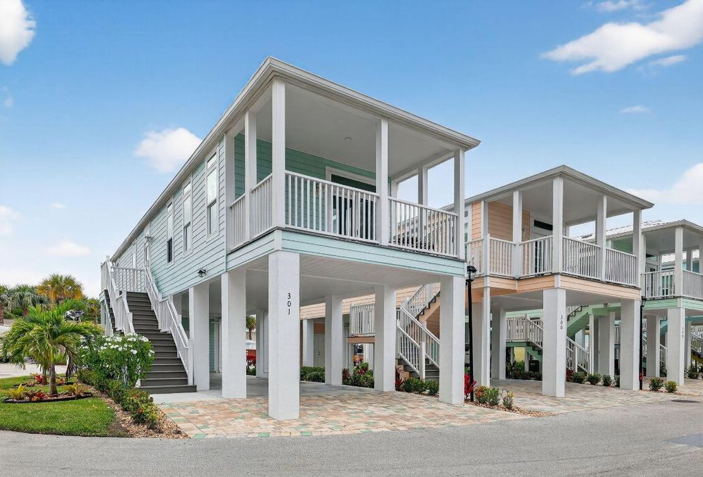 Photo of 301 NE Coastal Drive, Jensen Beach, FL 34957 (MLS # R11124042)