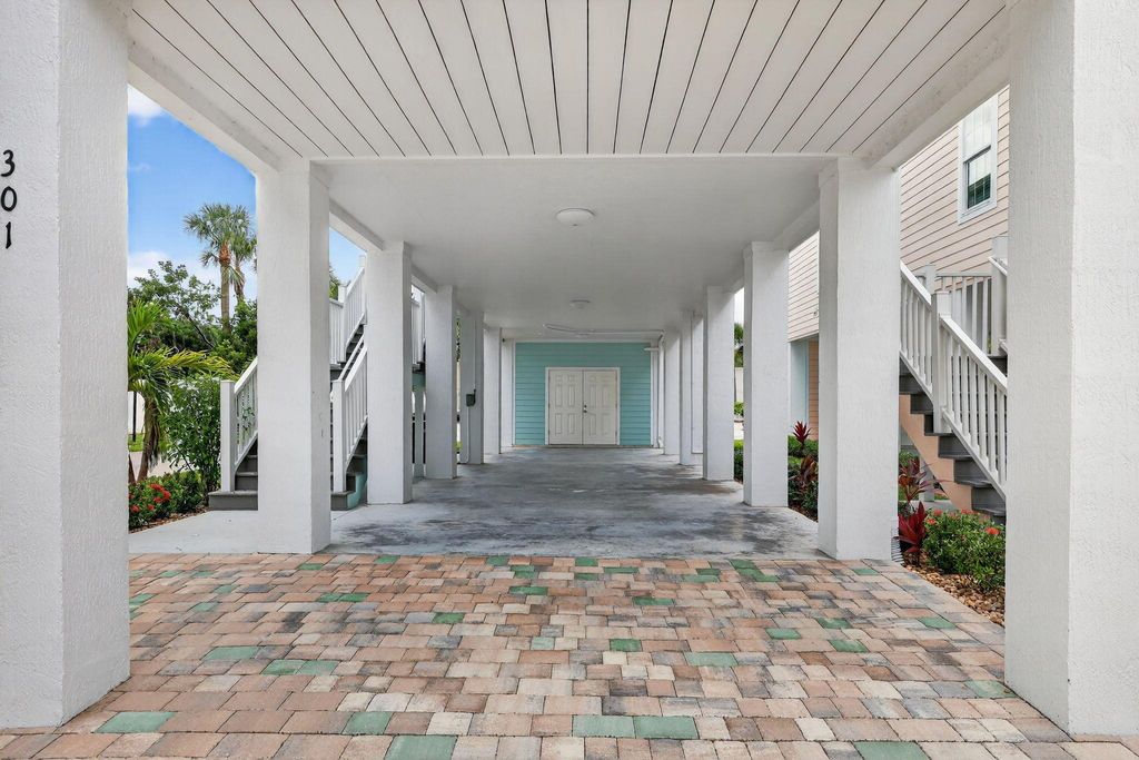 Photo of 301 NE Coastal Drive, Jensen Beach, FL 34957 (MLS # R11124042)