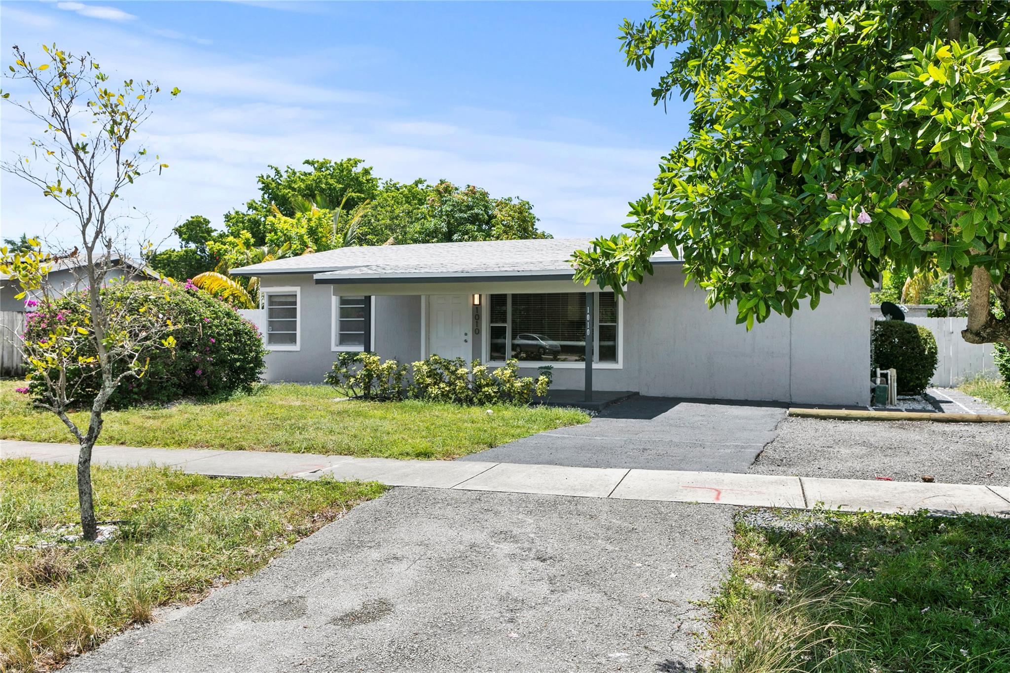 This beautifully updated 3-bedroom, 2-bath home offers comfort, style, and convenience in a prime Pompano Beach location—just minutes from the beach and major highways for an easy commute. Inside, you'll find gorgeous porcelain tile flooring throughout, freshly painted walls, modern lighting, and tastefully upgraded bathrooms. The refreshed kitchen features contemporary cabinetry and finishes, and washer & dryer, ideal for everyday living. Outside, enjoy a private fenced yard, paved driveway, decorative backyard tile, and a storage shed. There is also plenty of parking! A perfect rental for those seeking a well-maintained home near all that Pompano Beach has to offer!