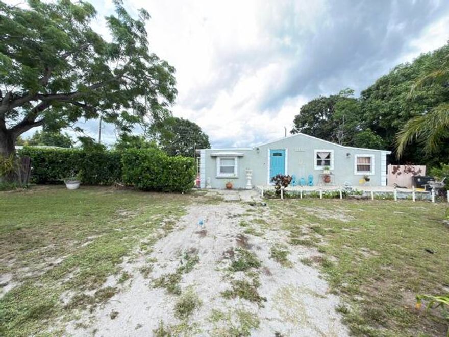 Rare opportunity to own a home on an oversized 0.28-acre lot in Boynton Beach, nearly double the size of many neighboring properties. No HOA, low current property taxes, and Residential Multi-Family zoning offer exceptional flexibility and future potential. Tax records reflect a 2BR/1BA home currently configured as a functional 4BR/1BA. The property features mature mango, avocado, quenepa, and guanábana fruit trees, plus front and rear decks. Roof replaced in 2022 and septic system recently serviced. Conveniently located minutes from the beach, shopping, dining, and major destinations in Delray Beach and West Palm Beach. A unique opportunity for homeowners and investors alike. Additional Remarks Tax records reflect 2BR/1BA; home is currently configured as a functional 4BR/1BA. Buyer to verify permits, legal use, zoning, square footage, and all measurements. Residential Multi-Family zoning. No HOA. Low current property taxes. Roof replaced in 2022. Septic system recently serviced (November). Minutes from the beach, shopping, dining, Atlantic Avenue, and CityPlace. Oversized 0.28-acre lot compared to many neighboring lots of approximately 0.14 acres or less. Mature fruit trees: mango, avocado, quenepa, and guanábana.