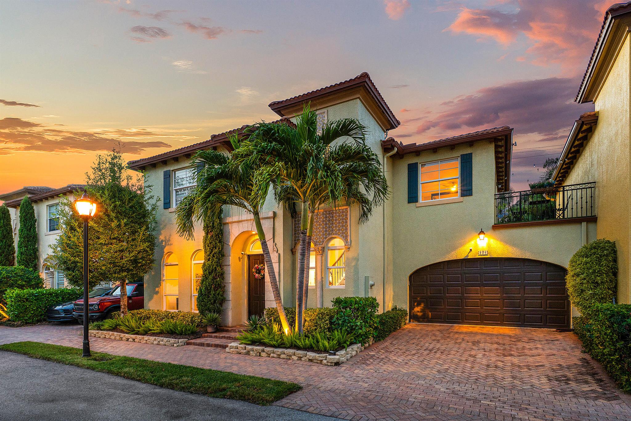 Welcome to this 3-bedroom, 2.5-bathroom luxurious townhome in the highly sought-after gated community of Royal Poinciana in East Boca Raton. Impeccably finished and professionally designed, this residence is being offered fully turnkey for its proud new owner.Step inside to discover rich wood flooring throughout and a stunning spiral staircase awaits as you enter through your foyer with soaring ceilings. Expansive high-impact windows and doors flood the home with natural light, enhancing the spacious open-concept layout.The oversized chef's kitchen features natural stone countertops and backsplash, tons of cabinet and counter space, a breakfast bar overlooking the family room, and seamless flow to the main living areas.