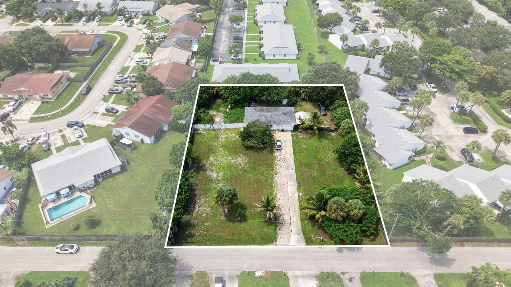 Photo of 9179 SUNRISE Drive, West Palm Beach, FL 33403 (MLS # B26075873)