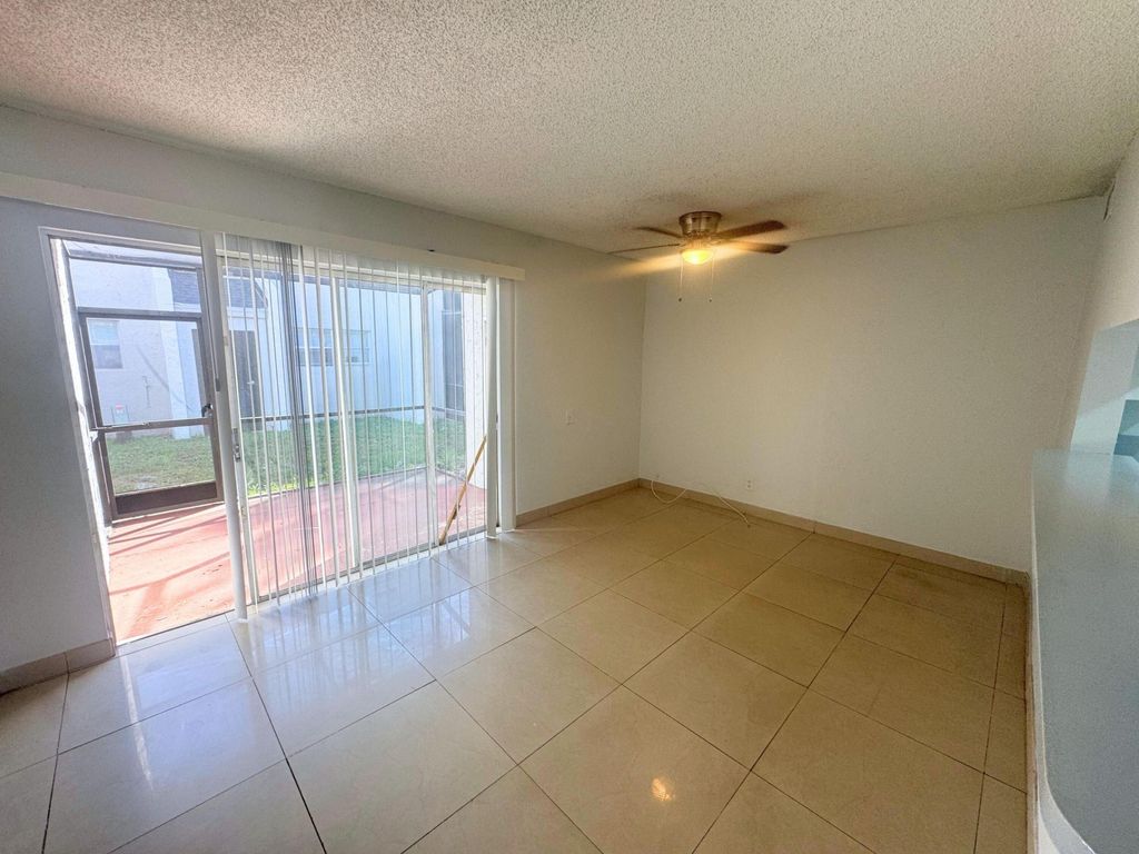 Photo of 4423 Treehouse Lane #21c, Tamarac, FL 33319 (MLS # B26044336)