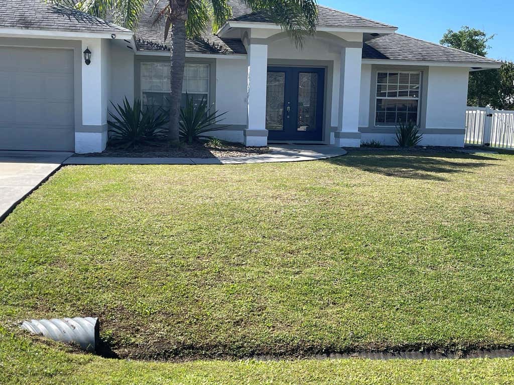 Photo of 1418 SW Sudder Avenue, Port Saint Lucie, FL 34953 (MLS # F10427854)