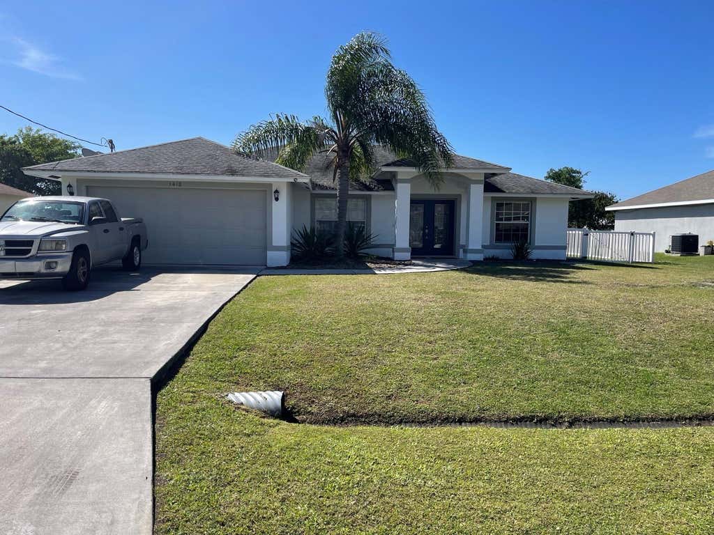 Photo of 1418 SW Sudder Avenue, Port Saint Lucie, FL 34953 (MLS # F10427854)