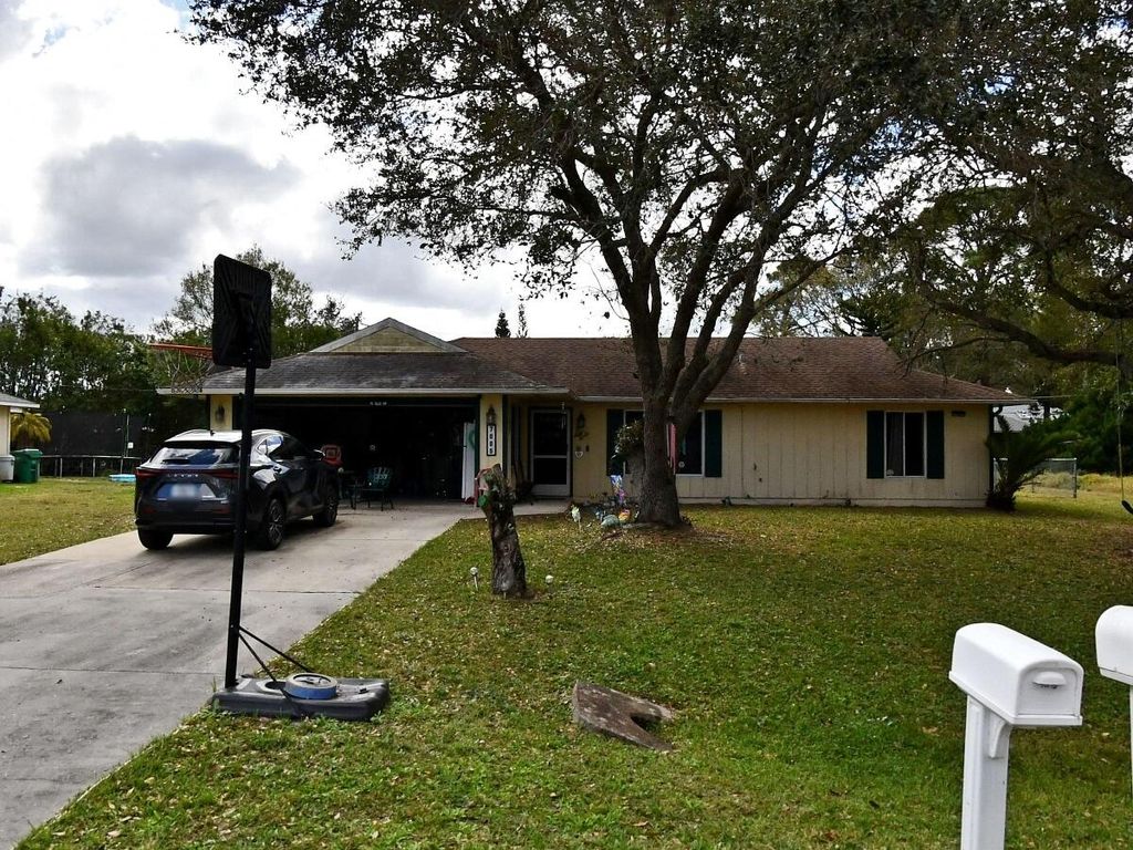 Photo of 7005 Ocala Avenue, Port Saint Lucie, FL 34951 (MLS # R11136887)