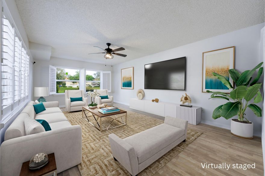 Motivated sellers, ready for all reasonable offers! Price reduced! Welcome to this charming 2-bedroom, 2.5-bath lake view townhome nestled in the gated community of Wellesley at Lake Clarke Shores. Step inside to discover a spacious open-concept floor plan, featuring stylish plantation shutters and durable tile and laminate flooring. The kitchen is equipped with stainless steel appliances, tile countertops, under-stairs storage off the dining area, with a washer and dryer tucked away in the half bath. Upstairs, enjoy engineered flooring, crown molding, and ceiling fans, along with ample storage, including a walk-in closet in the master suite. The master bathroom boasts dual sinks, and the second bedroom's bath has been tastefully remodeled.