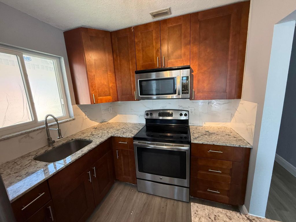 Photo of 5441 SW 18th Street, West Park, FL 33023 (MLS # B26014991)