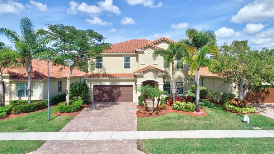 Presented here is a beautifully upgraded and lovingly maintained lakefront pool home in Wellington's Oakmont Estates. This home has  complete hurricane Impact doors and windows. Since buying the home in 2017 the sellers have added the pool with its sundeck, bubbler, multi-colored lights and Heat Pump, surrounded by paver pool deck and  a Panoramic View screen enclosure overlooking the lake. They renovated the kitchen with a custom extended island, beverage fridge and a wine fridge. Quartz countertop., counter seating. and under cabinet lightening. And the newly renovated 2nd floor laundry is just amazing, featuring GE Fresh Vent front loader washer/dryer! The whole house is gorgeous,, and the community is too! Come see your new home! Info and dimensions deemed accurate but not  guaranteed.