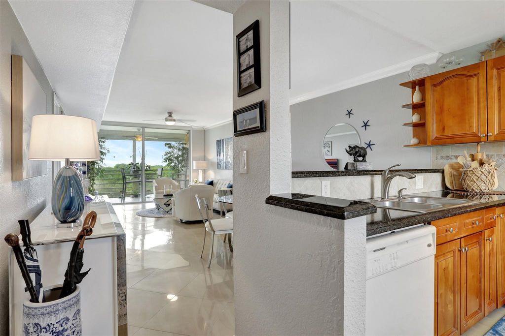 Photo of 575 Oaks Ln #704, Pompano Beach, FL 33069 (MLS # F10402068)