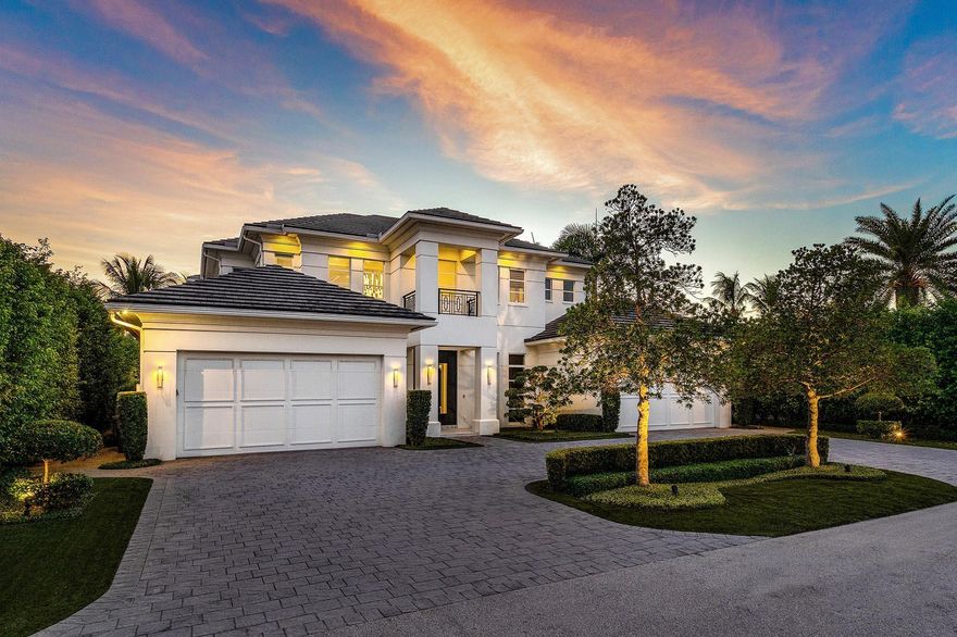 Custom built in 2017 by SRD Building Corp and styled by award-winning P&H Interiors, this 5,035-square-foot estate offers an elevated lifestyle within Royal Palm Yacht & Country Club. Designed for effortless living, the residence features four-bedroom suites, four full and one half bathroom, and a layout that balances comfort with everyday elegance.The gourmet kitchen, equipped with premium appliances and a welcoming eat-in dining space, flows seamlessly into the great room. A private study with custom wood built-ins provides a polished retreat for work or quiet focus. The first-floor primary suite offers a spa-like escape with generous His and Her closets.Outdoors, the property is a private sanctuary. A custom heated pool surrounded by lush landscaping sets the stage