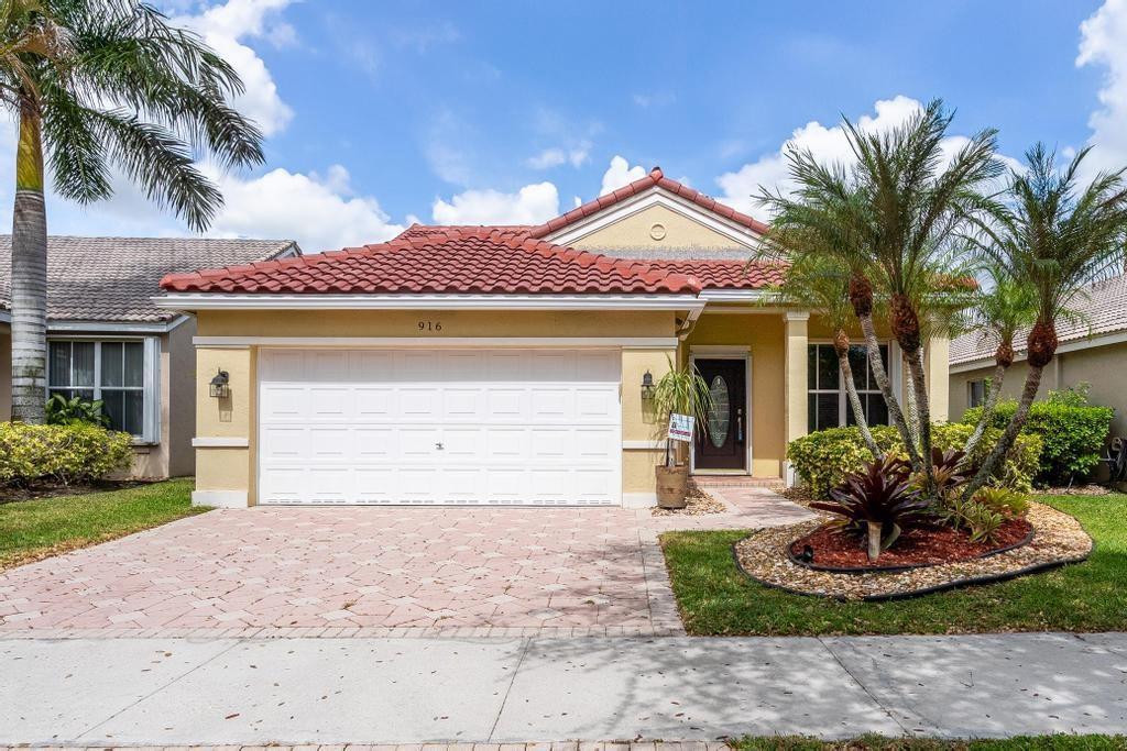 Stunning wide lakefront home with serene water views and incredible sunsets. Enjoy peace of mind with a brand-new roof (May 2025). Move-in ready with full interior remodel—new flooring throughout, refaced kitchen, and beautifully updated bathrooms. French doors and soaring ceilings create an airy, elegant feel. Situated on a premium lot with endless potential and enhanced curb appeal thanks to an elegant paver driveway. Located in a top-tier school zone with access to resort-style community amenities. This one has it all—location, lifestyle, and lasting value.