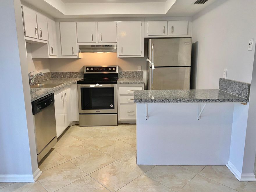 Lake View 2 bedroom 2 bathroom-FIRST FLOOR-Stainless Steel appliances. Tiled throughout and newly painted. Washer & Dryer in unit. Centrally located in Greenacres with nearby shopping, local attractions, and beaches.. Screened patio overlooking the large lake- All Ages community. WATER included in the rent. Credit score 650+ required by association.