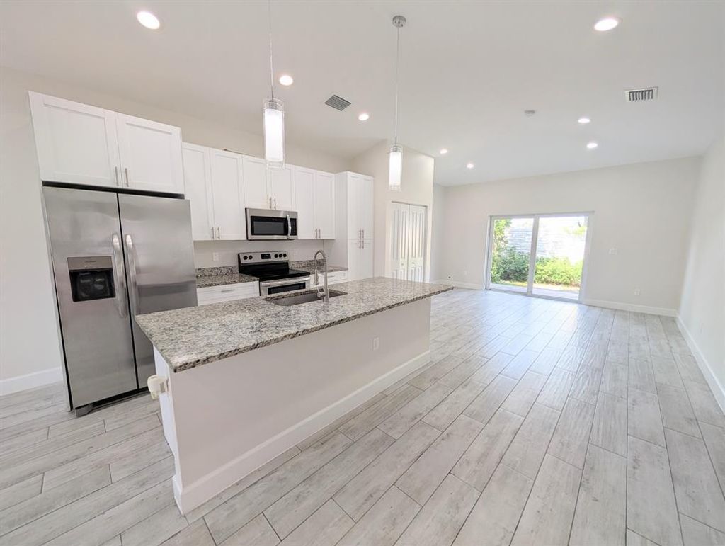 Photo of 15621566 W 26th Court, Riviera Beach, FL 33404 (MLS # B26018837)