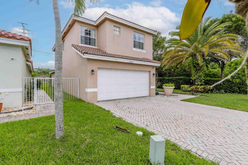 Photo of 4066 Crescent Creek Street, Coconut Creek, FL 33073 (MLS # R11098756)