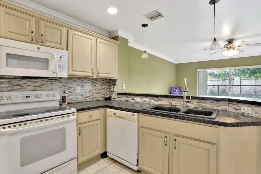 Photo of 4066 Crescent Creek Street, Coconut Creek, FL 33073 (MLS # R11098756)