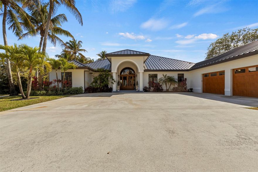 Completely rebuilt and reimagined in 2024, this exceptional Wellington estate offers luxury, flexibility, and thoughtful design at every turn. Currently operating as a charming alpaca farm, the property was intentionally designed to accommodate horses while allowing for a wide range of lifestyle uses. Whether you envision an equestrian retreat, hobby farm, seasonal income property, or a private estate close to the show, the options here are truly endless.Positioned directly on the bridle path with private gate access for hacking distance to Winter Equestrian Festival, you enjoy prime proximity without sacrificing privacy or peace of mind. 2024- Roof, Water Heaters, Electrical, Plumbing and Appliances, Barn & Workshop- 2016 A/Cs recently serviced. 500 gallon propane tank. Inside, the home is absolutely stunning. Brand-new electrical and designer lighting throughout, wide-plank wood floors, new water heaters, and a complete redesign of every bedroom, bathroom, kitchen, laundry, and living space create a true masterpiece. Designed for both elegance and functionality, the layout offers three distinct entertaining areas including a formal living room, a relaxed family living space, and a dedicated entertainment lounge with full bar setup. Every bedroom features its own en-suite bath, delivering a true luxury guest experience.The 2024 hurricane-rated barn is concrete block construction and includes the required Wellington horse hair trap system. Designed with six 12x12 stalls, each featuring individual run-outs, the barn currently functions for alpacas but was purpose-built with horses in mind. Stalls are equipped with mats and were constructed to accommodate the future installation of stall mattresses if desired. A small tack room includes a sink and refrigerator, along with a washer, dryer, and half bath for added convenience.The 1,500+ square foot warehouse is also 2024 construction with a metal roof and private entrances. Ideal for equipment storage, workshop use, feed and tack conversion, staff quarters, or additional income potential. The barn and warehouse were strategically positioned to allow ample space for an arena sized to your preference.The chef’s kitchen is beautifully appointed with a Wolf range, Sub-Zero separate refrigerator and freezer, dual dishwashers, and an elegant butler’s kitchen with its own sink and full-size Sub-Zero refrigerator and freezer combination. The entertainment lounge includes double beverage refrigerators, a dishwasher, and a full bath that doubles as a pool bath. The thoughtfully designed laundry room connects directly to a private dog run, keeping pets secure and separate from pasture areas. Every detail was carefully considered.Fully fenced and cross-fenced pastures, two separate gated entrances for home and barn access, a 500-gallon propane tank, dual zoned A/C systems under 10 years old and recently serviced, and virtually all new systems throughout provide peace of mind and storm-ready durability.Luxury. Versatility. Location. Income potential.This is Wellington living without compromise, designed for whatever chapter you choose next.