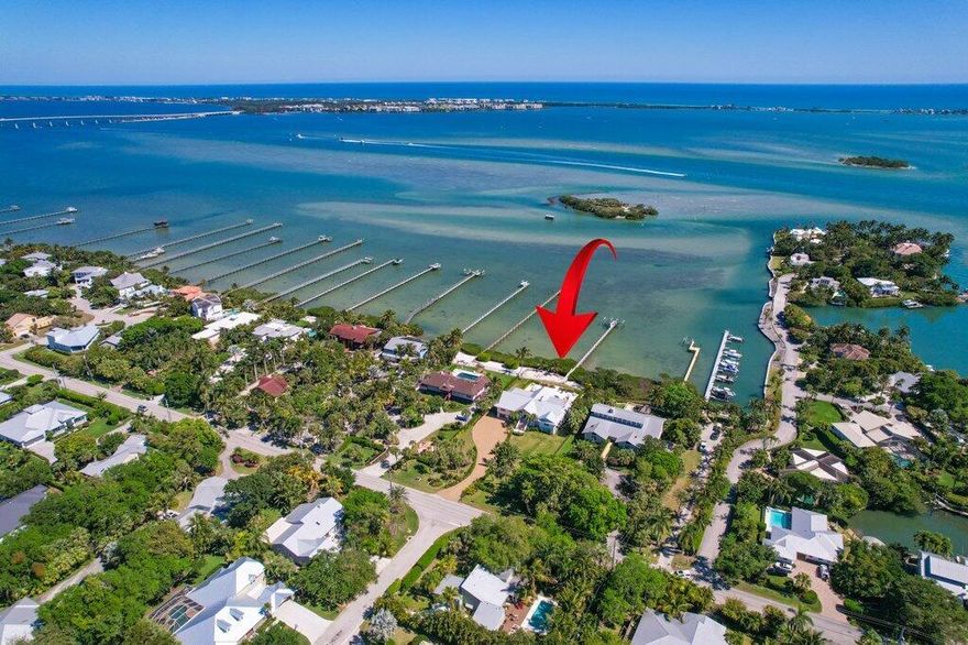 Coastal Elegance Redefined - A Waterfront Masterpiece in Sewall's Point.  Nestled along 132 feet of breathtaking turquoise blue Intracoastal waters on just under an acre, this estate is a true architectural gem, reimagined in a Hamptons-meets-California style by the renowned Kelly & Kelly Architects. Over the course of a meticulous three-year renovation, this estate has been completely transformed, offering an exquisite blend of timeless sophistication and modern luxury, all with unparalleled views of Bird Island.

Designed for effortless waterfront living, this home has been rebuilt from the ground up, featuring block construction on the lower level and HardiePlank siding on the main level. All-new impact glass doors and windows, a reinforced garage door, new electrical, plumbing, dual tankless hot water heaters, A/C units, and a whole-house generator.

Inside, every detail has been thoughtfully curated. Stunning custom woodwork graces every room, wall, and ceiling, while soaring impact windows frame panoramic water views from every space. A dramatic three-sided quartzite fireplace anchors the living area, flowing seamlessly into the chef's kitchen, where a 60" Viking range, two dishwashers, a panel-ready refrigerator, and a separate bar with wine refrigeration create an entertainer's dream.

The primary suite is a private retreat of its own, offering a tranquil sitting area and an indulgent spa-like bath, wrapped in marble, Carrara, limestone, and slate. 

The resort style patio and backyard features a built in grilling station with refrigeration and wine/beverage storage, a salt chlorinated pool with tumbled marble pool deck and four fire features enhance the ambiance, creating an atmosphere of refined relaxation.  Stunning sunrises and the beautiful views are endless. 

For the boating enthusiast, the new Trex dock is fully equipped with two boat lifts, water and electrical service, snook lighting, a ladder for easy access, and full dock illuminationready for days spent exploring the sparkling waterways. A residential elevator provides effortless access to all levels.

Basement area has 4 car garage, gym/workout area, and additional storage.  Plans are available to build an additional guest house and 5 car garage.  You will not find this anywhere on the Treasure Coast! Currently the 4th bedroom wall was removed to have another family room, but could easily be added back.  Please see plans/renderings attached. 

Set in the heart of Sewall's Point, a sanctuary for birds and native flora, this extraordinary waterfront estate is a rare offering of elegance, craftsmanship, and coastal beauty.

A home of this caliber is rarely available.  schedule your private showing today.