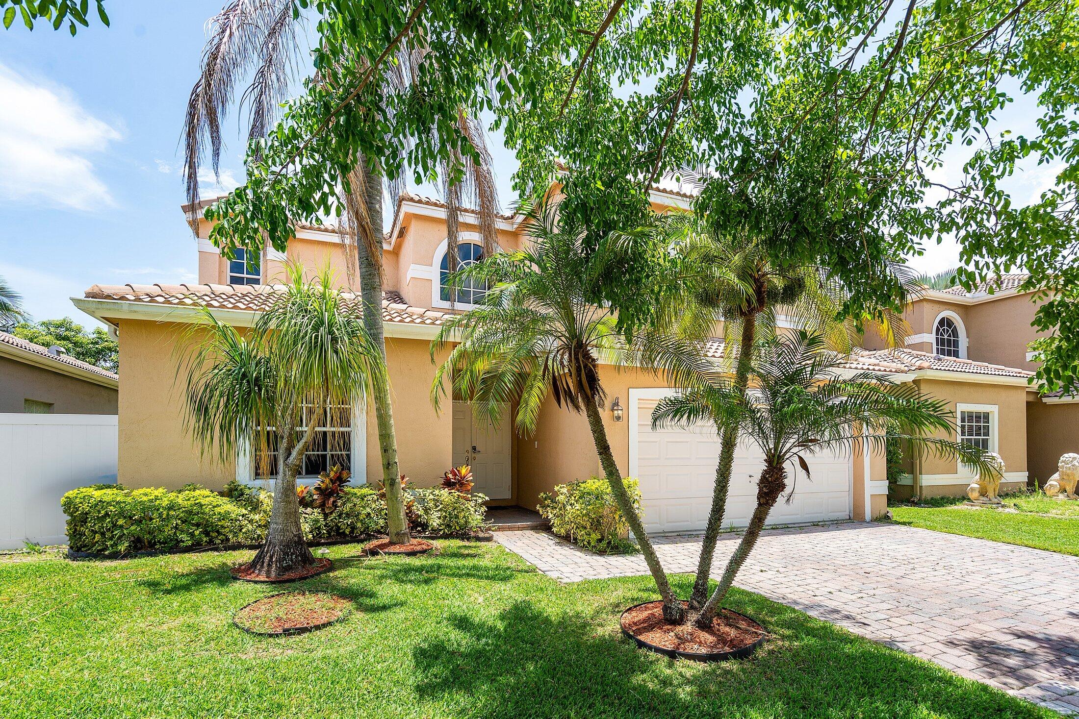 Great opportunity to buy this beautiful home in Cocobay! This 4/3 with 2-car garage features an exceptional layout with 2 bedrooms downstairs & 2 bedrooms & a loft upstairs. As you enter, you're greeted by high ceilings in the main living area, which flows into the formal dining room, renovated kitchen, & cozy family room. The patio area has been converted into a playroom/extra bedroom with its own A/C. The spacious downstairs primary suite has a walk-in closet, dual sinks, & the primary bathroom features a separate shower & Roman tub. Cocobay is a gated community perfectly positioned near the Turnpike & Sawgrass Expressway & walking distance to Lyons Creek Middle School. The HOA provides lawn care, clubhouse, pool, exterior lighting, & advanced security features. Must See!