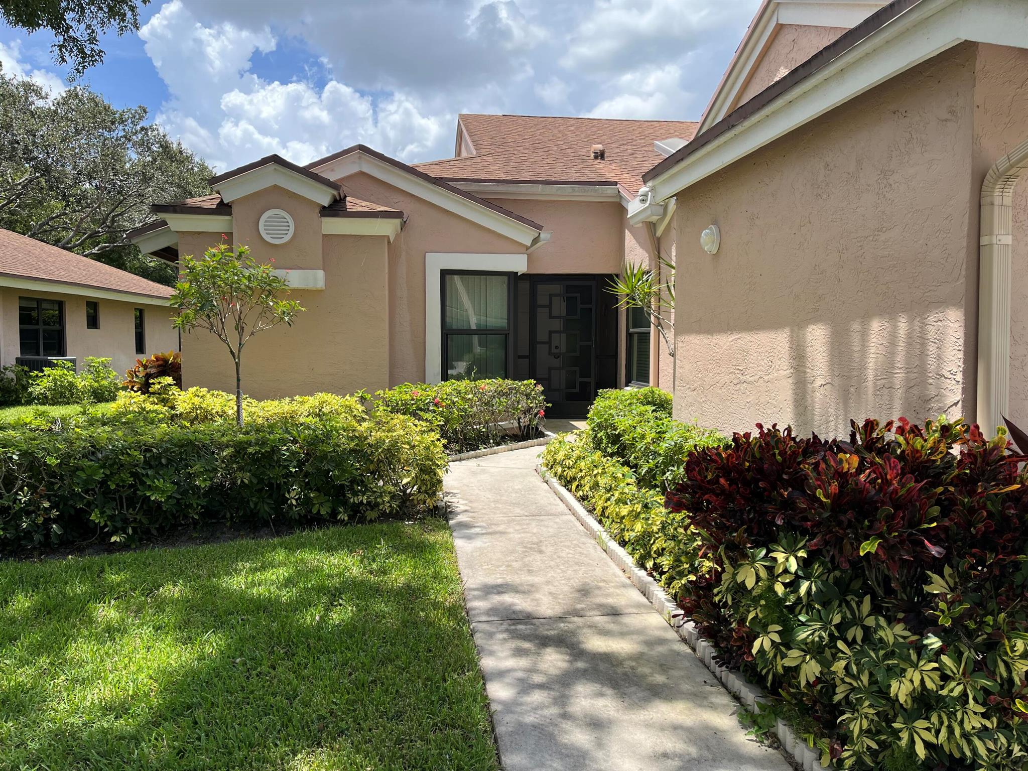 Introducing a spectacular completely renovated Regal model villa. The home exudes mid-century modern design elegance and comfort, and stunning property features - customized European style kitchen of the highest quality, as well as additional custom banquettes and vanities in both bathrooms. The brand new luxury, commercial grade vinyl flooring is easy care while creating the illusion of hardwood. The upgrades abound with statement chandeliers in the foyer and dining room, accent wall paper, new tile flooring in bathrooms, and new wool carpeting in bdrm. Impact windows, Skylights. Located in a desirable 55+ neighborhood with new pickle ball courts, private club house, large pool, workout room, library and games room. Don't miss the opportunity to make this exquisite residence your own.