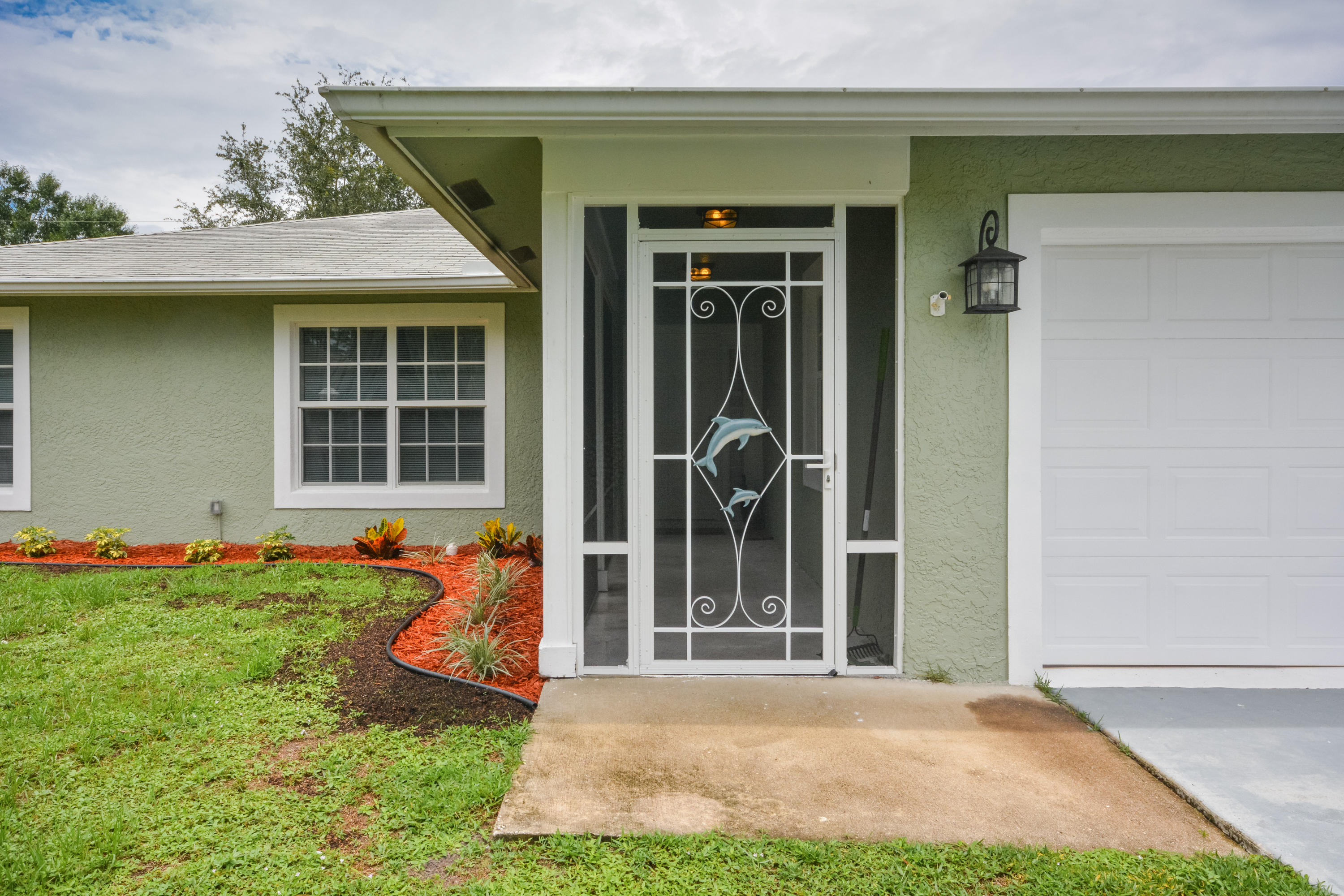 IMMACULATE 3/2/2 CBS Port St Lucie Home Seeking New Owners!!! This Amazing Home has many GREAT features such as: Impact Resistant Glass Throughout, Open Concept Great Room,Tile in Main Living Areas, Large Kitchen with Newer Stainless Steel Appliances, Water Filtration System,Large Master Suite, Master Bath with Jacuzzi Tub, 2016 Hot Water Heater, Washer & Dryer switched for ones in the garage (3 Years Old), Recently Painted Interior and exterior, Large Screen Enclosed Patio, New Landscaping and much more. This Home is a MUST SEE! Call today for your private tour!!!