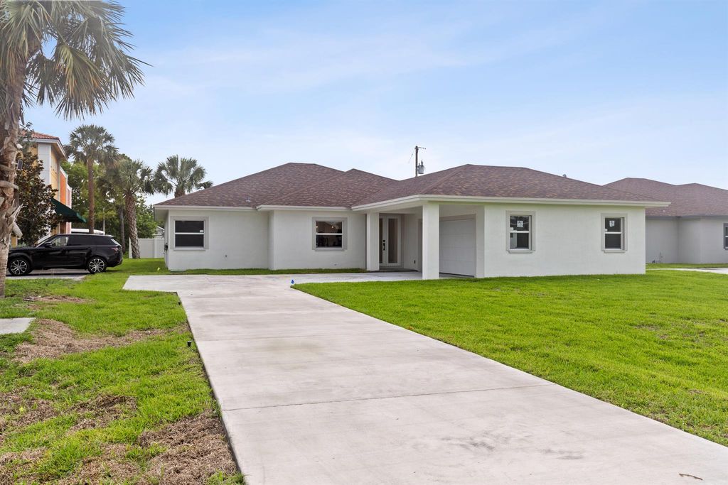 Photo of 4037 SW Port St Lucie Boulevard, Port Saint Lucie, FL 34953 (MLS # R11097201)