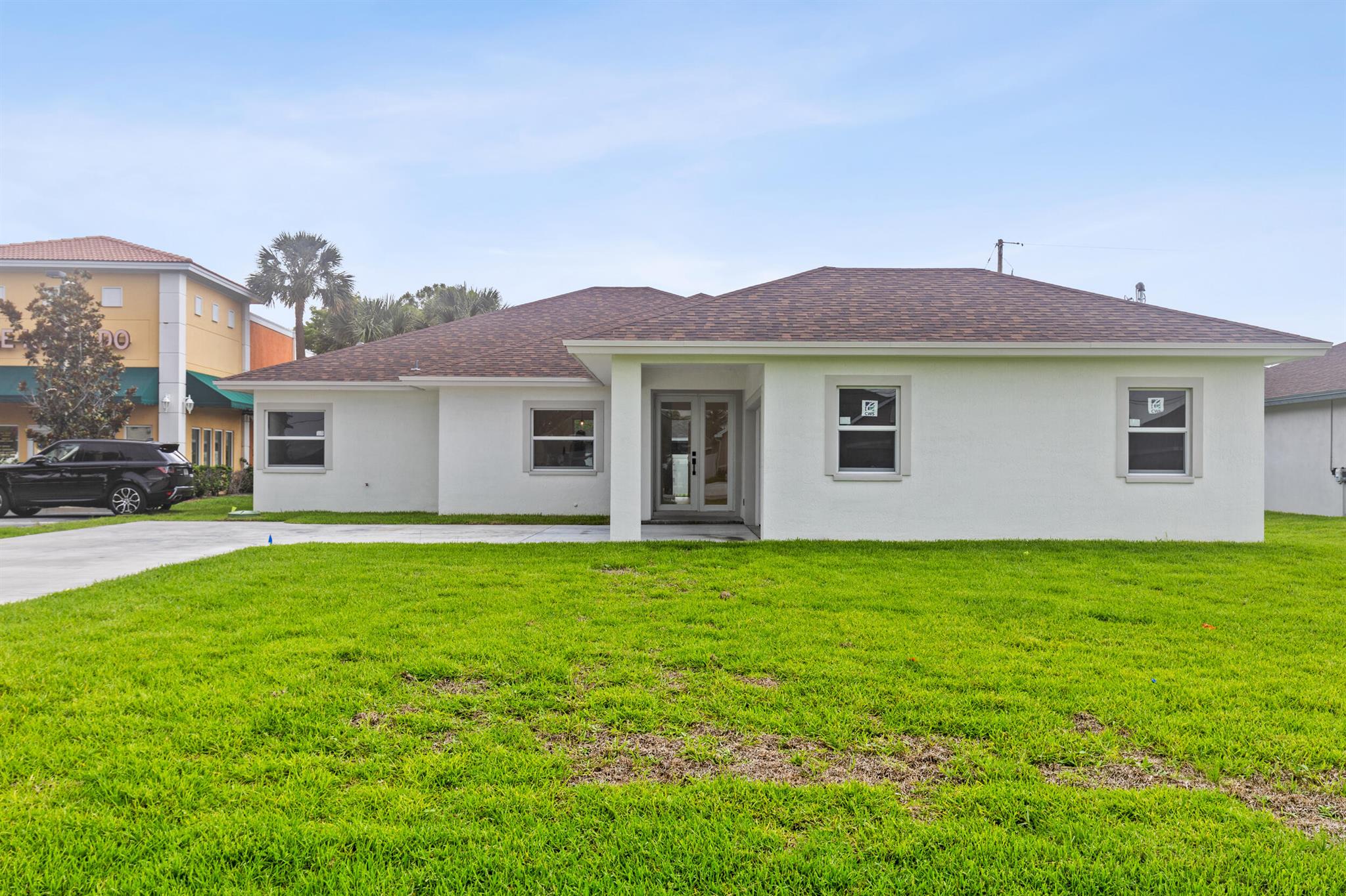 Stunning new construction home in the heart of Port St. Lucie with NO HOA! This spacious 3 bed, 3 bath residence is filled with natural light, soaring ceilings, and luxurious designer finishes throughout. The open-concept kitchen boasts sleek waterfall countertops, brand new appliances, and ample space for entertaining. The primary suite offers his & hers walk-in closets, and an elegantly designed bathroom featuring a free-standing tub, dual vanities, and a zero-entry shower. Step outside to a beautiful covered patio, perfect for relaxing or hosting guests. Every detail has been thoughtfully curated for style and comfort. Enjoy the freedom of no HOA in a prime location close to shopping and dining. Don't miss this move-in ready gem!