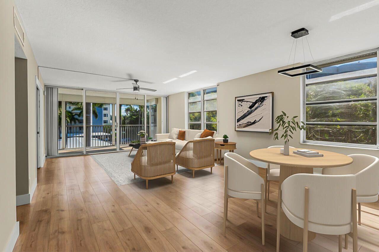 Available for RENT or purchase. This stunning 3-bedroom, 2-bathroom corner unit offers the perfect blend of luxury and comfort, beautiful light and bright unit with PARTIAL marina and water view. Step inside to discover a completely remodeled interior featuring elegant luxury vinyl plank flooring throughout, stainless steel appliances and quartz countertops.The spacious bedrooms boast walk-in closets, providing ample storage space. Enjoy the serene outdoors from your screened-in balcony, equipped with roll-out storm shutters and accordion shutters. This unit includes a convenient storage space and access to the community's clubhouse and marina.