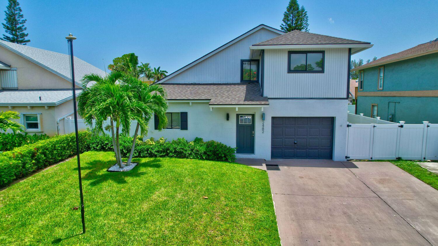 Welcome to your dream home all under a new roof and Impact Windows throughout the home! 3BR/2BA FULLY FURNISHED, Turnkey, Spectacular Location with NO HOA. Walk to Wholefoods & Shopping. Minutes away from Downtown Delray and Beaches. Available for Seasonal or Annual Rental. This stunning Resort property has undergone a complete transformation and boasts all the modern amenities you've been searching for. Situated on a generous plot, the privacy fence surrounding the backyard ensures tranquility and seclusion. Step inside and be captivated by the inviting ambiance of the open floor plan, highlighted by a vaulted cedar plank ceiling. The Brand New kitchen, is a chef's delight with a large island adorned with luxurious quartz countertops, equipped with top-of-the-line