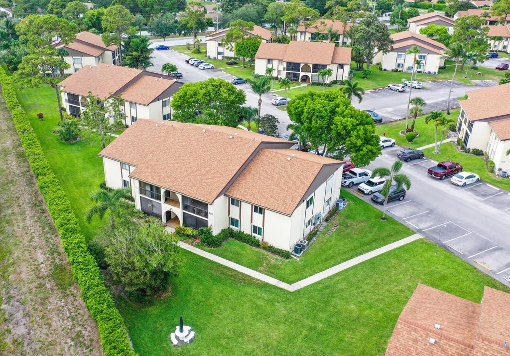 Photo of 5930 Whispering Pine Way #C-2, Greenacres, FL 33463 (MLS # B26055960)