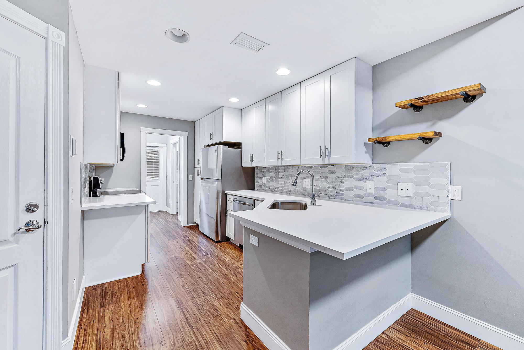 RENOVATED!! Beautifully updated townhome in Abacoa. Nestled away in charming community of Charleston Court, this unit is not located on a main road, and has a wrap around side walk with plenty of outdoor space for activities. This 3 bedroom/2.5 bath unit has been tastefully remodeled with luxury bamboo vinyl flooring throughout the unit, shaker cabinets in the kitchen, Quartz countertops, Samsung appliances, Whirlpool washer/dryer, bathrooms have new vanities, fully redone showers and much much more! You won't find another unit like this. Don't miss out on this great opportunity!