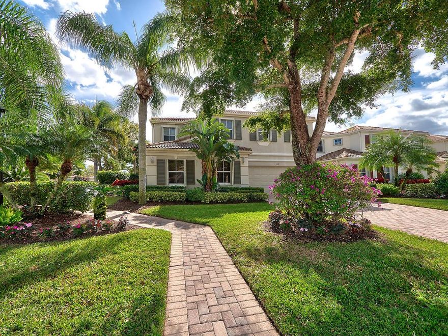 HIGHLY UPGRADED AND BEAUTIFULLY REMODEDLED TWO STORY HOME WITH 4 BEDROOMS AND 3 FULL BATHS. MASTER AND GUEST ROOM ARE ON THE FIRST FLOOR! ALL NEW FLOORING WITH BOTH 'WOOD LOOK' CERAMIC TILE AND DESIGNER CARPETING.STUNNING WINDOW TREATMENTS AND LIGHTING FIXTURES. HOME HAS BEEN FRESHLY PAINTED. KITCHEN WITH GRANITE COUNTER TOPS AND NEW DISHWASHER. NEW WASHER/DRYER AND THE GARAGE DOOR OPENER HAS BEEN RECENTLY REPLACED. SECOND FLOOR HAS A GREAT LOFT AREA... PERFECT WORK PLACE OR PLAY AREA FOR GRAND CHILDREN...... TWO FULL BEDROOMS AND SHARED FULL BATH. BEAUTIFULLY SCREENED IN PATIO WITH POOL AND SPA.... ALL PROFESSIONALLY LANDSCAPED.... PRIVATE OASIS! HURRICANE SHUTTERS THROUGHOUT. 
AVAILABLE WITH SOCIAL MEMBERSHIP, FURNITURE AVAILABLE OR TURNKEY! TOTAL PACKAGE!!NOT TO BE MISSED!!