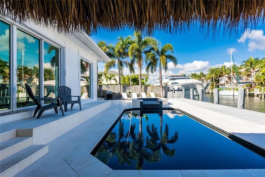 New price! And new roof March 2024. Home located on one of the most exclusive streets in town. 90 feet on the water, only 4 lots off intracoastal. Lots of potential. Build your dreamhome or utilize the current house. The home has been renting as an airbnb. Large outdoor space with pool, tiki & dock. Kitchen, dining area and livingroom is one open space with steps separating the different areas. You will find the MB with attached larger balcony on the second floor together w/ ensuite with both shower, sink & dual sinks. The remaining bedrooms may be found on the first level. Bayview Elementary school district and a short distance to George English Park and Tennis Courts as well as the Galleria Mall, Hugh Taylor Birch State Park and the Fort Lauderdale Beach beach.