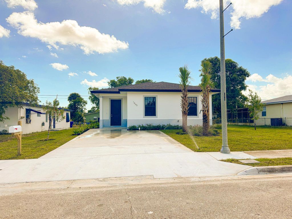 Photo of 1465 W 31st Street, Riviera Beach, FL 33404 (MLS # R10935428)