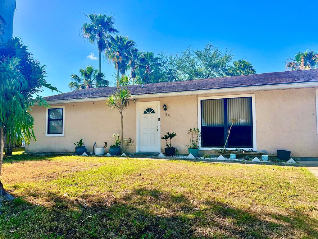 Photo of 1232 SW Sudder Avenue, Port Saint Lucie, FL 34953 (MLS # R10977756)