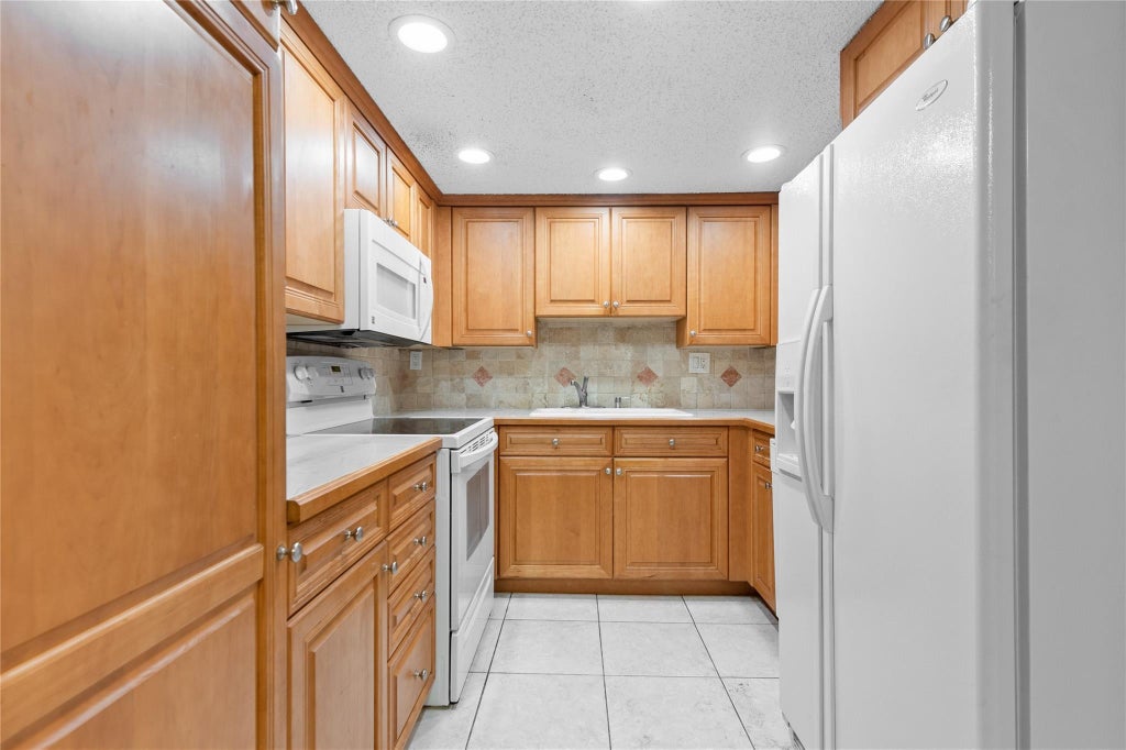 Photo of 11101 Royal Palm Boulevard #102, Coral Springs, FL 33065 (MLS # F10525659)