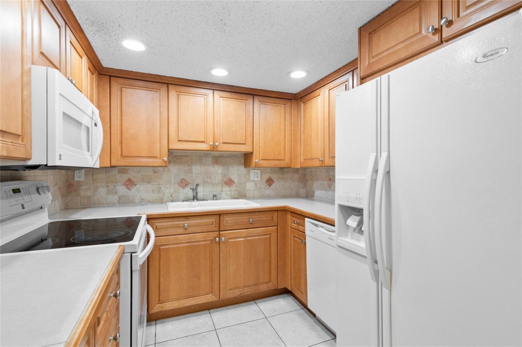 Photo of 11101 Royal Palm Boulevard #102, Coral Springs, FL 33065 (MLS # F10525659)