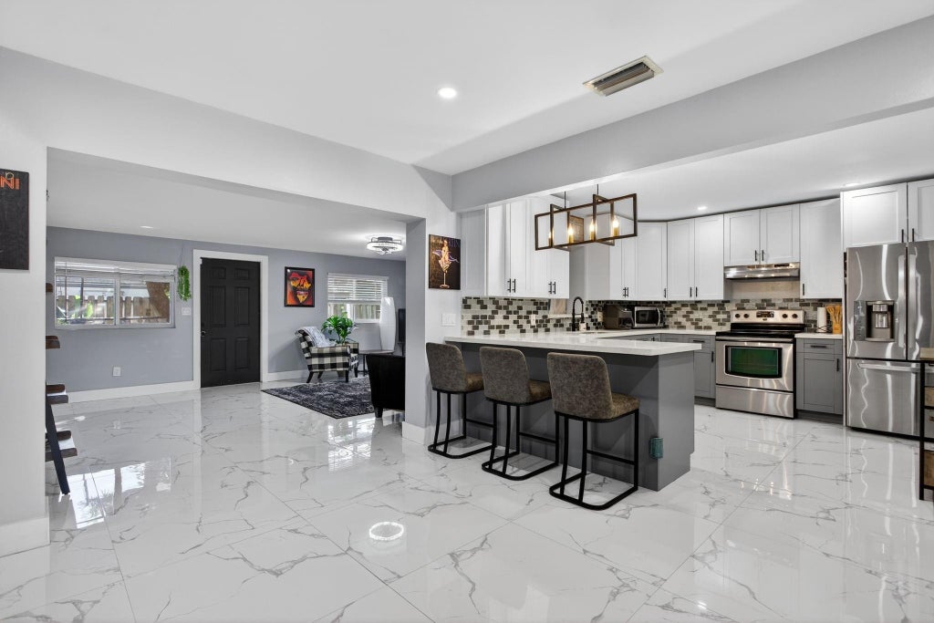 Photo of 3330 NW 69TH Street, Fort Lauderdale, FL 33309 (MLS # B26079002)